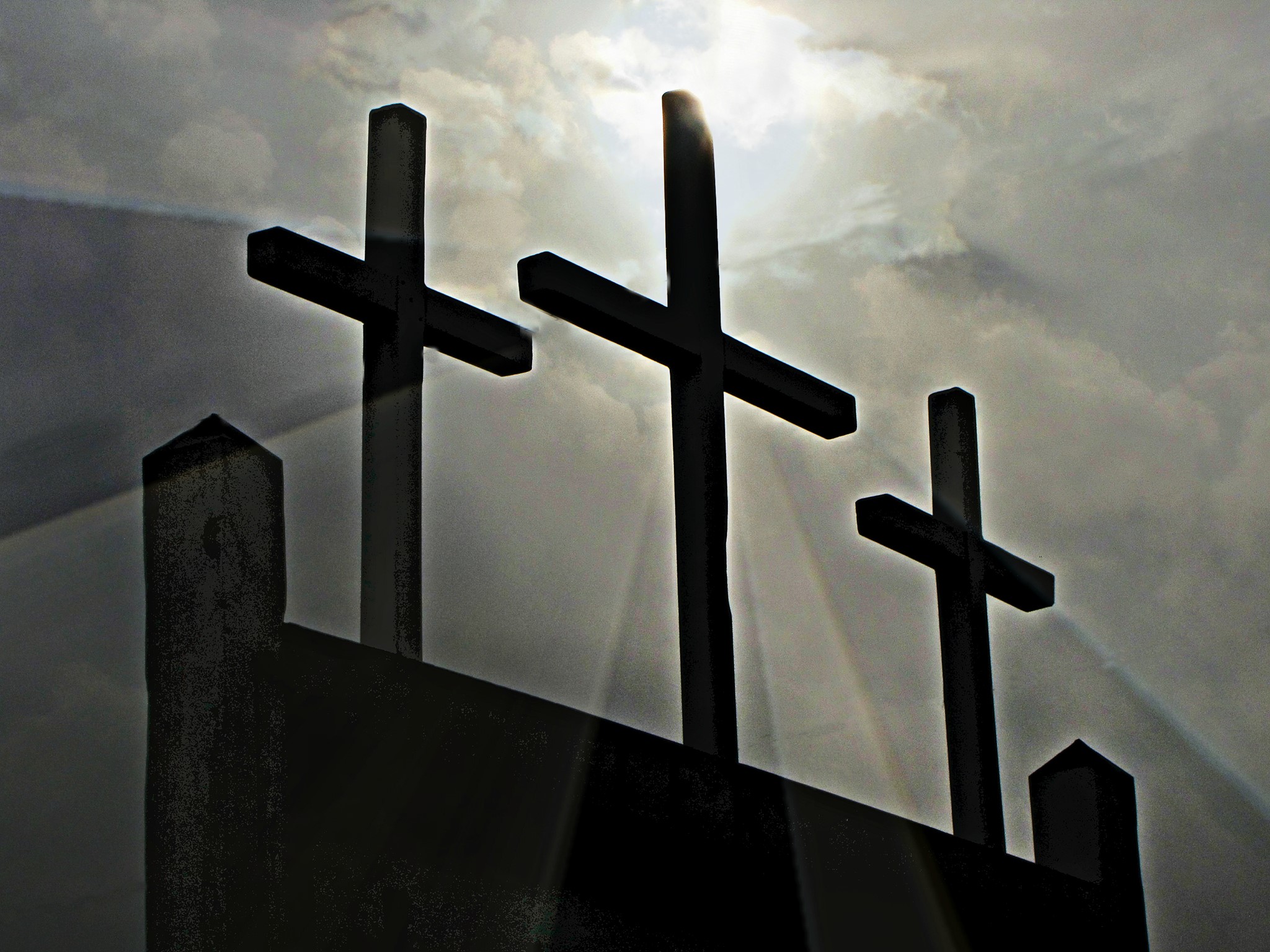 Three crosses representing prayer, sacrifice, and resurrection in the Christian faith
